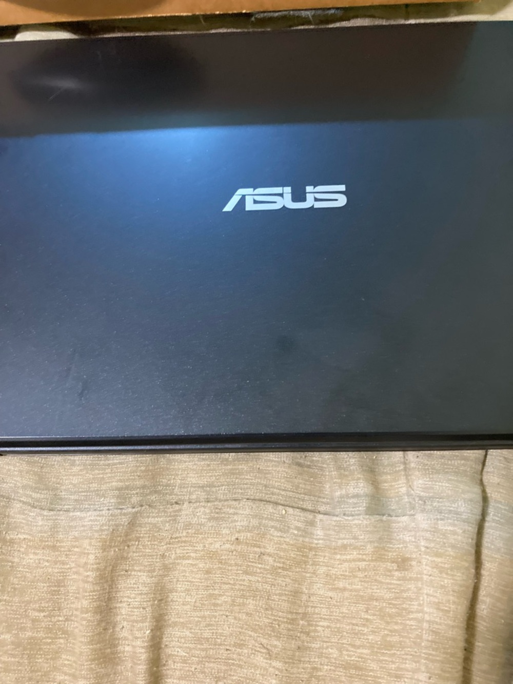 ASUS Black Laptop with Silver Logo - Compact Notebook